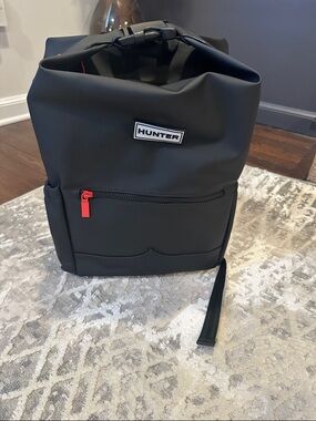 Hunter Black Roll-Top Backpack with Red Zipper Pull